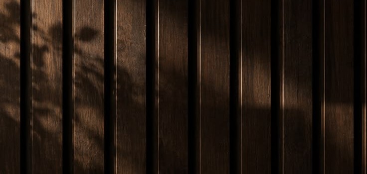Walnut slats in dappled light